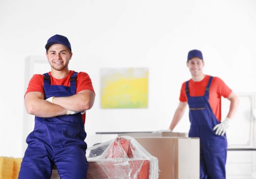 Removal workers handling furniture with care