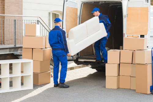A moving team in Haringey transporting boxes and furniture