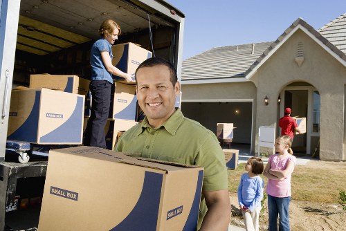 Packed boxes and furniture ready for home removals